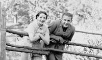 Alfred and Lynn leaning on the fence